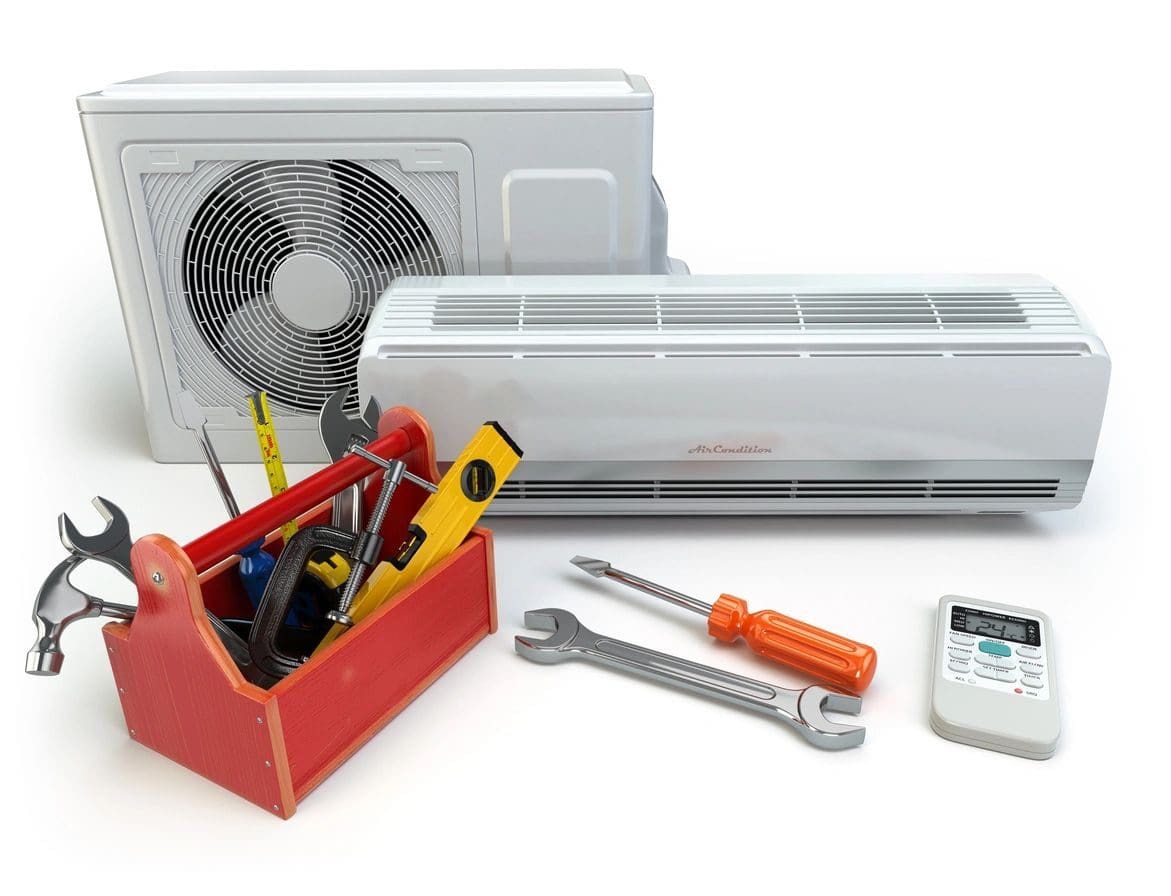 A toolbox with tools and air conditioner on the table.